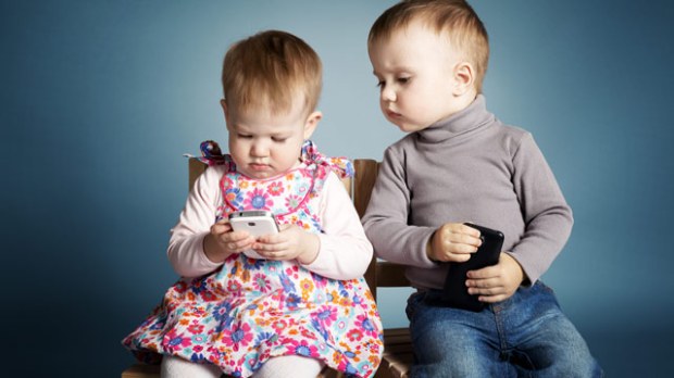 little-boy-and-girl-playing-with-mobile-phones.jpg